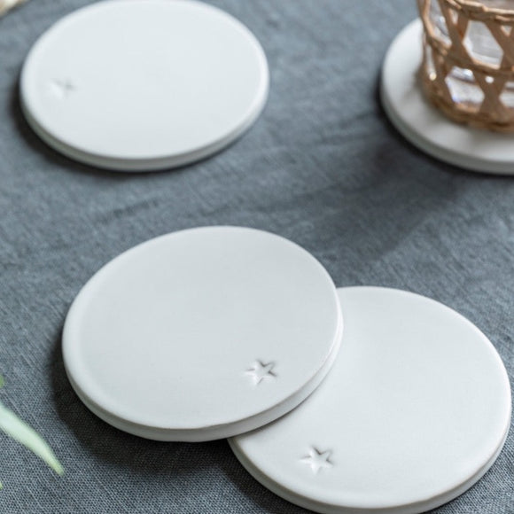 Set of Four White Ceramic Coasters With Star design From Garden Trading