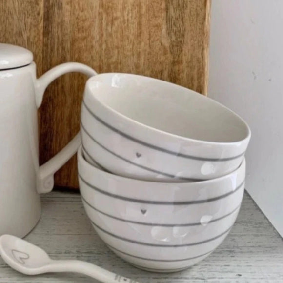 Set of two bowls each with grey stripes and a cute grey heart, perfect for your party nibbles