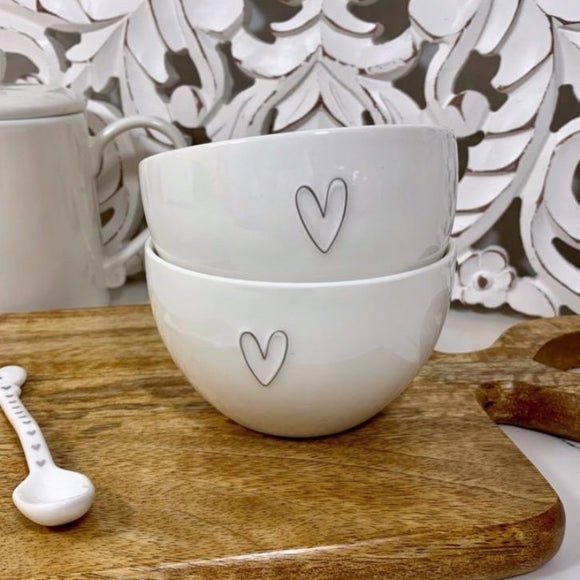 Set of two white bowls each with a cute grey heart design, perfect for serving nibbles