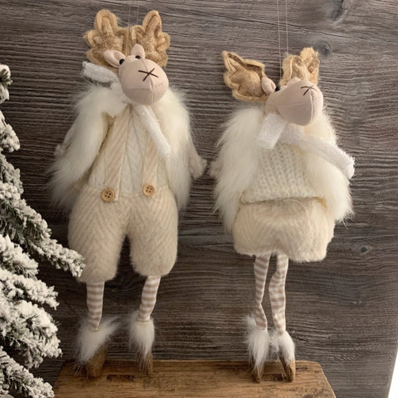 Christmas Boy and Girl Hanging Moose Reindeer in Fluffy Jackets